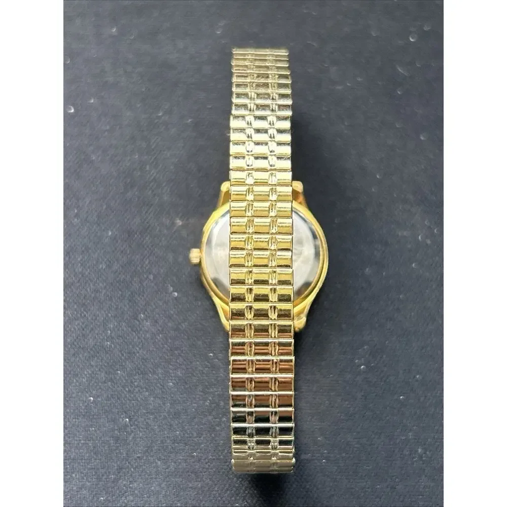 Embassy By Gruen Gold Tone Pink Dial Women’s Stretch Band Quartz Watch
